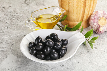 Black olives with oil and branch