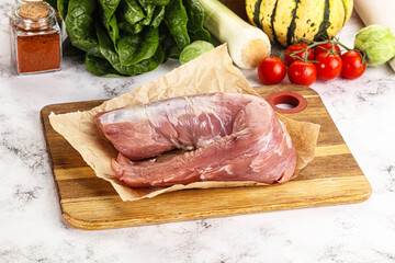 Uncooked raw pork tenderloin with spices