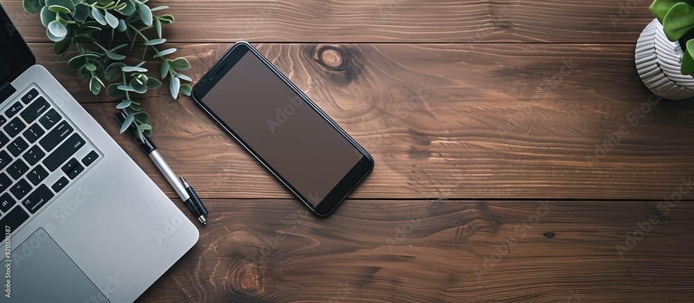 Poster top view of a wooden office desk showcasing a notebook and smartphone with ample copy space image av