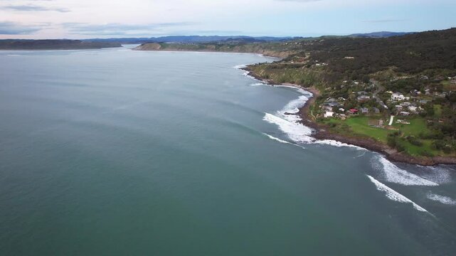 Beachfront Holiday Villas And Homes On Whale Bay In Raglan, North Island, New Zealand. Aerial Drone Shot