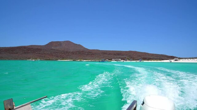 Beautiful turquoise water crystal clear with volcano in the background, Isla Coronado, Loreto, Baja California Sur