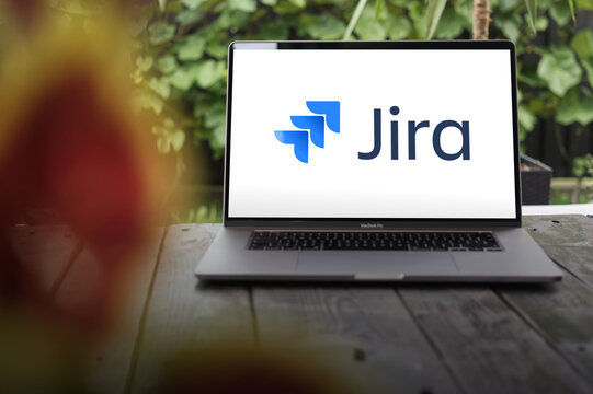 Jira logo, powerful project management tool by Atlassian for agile teams, offering tracking, planning, and collaboration features, displayed on MacBook Pro screen