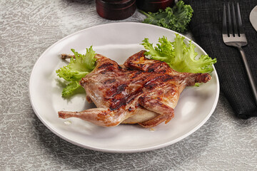 Grilled quail in the plate