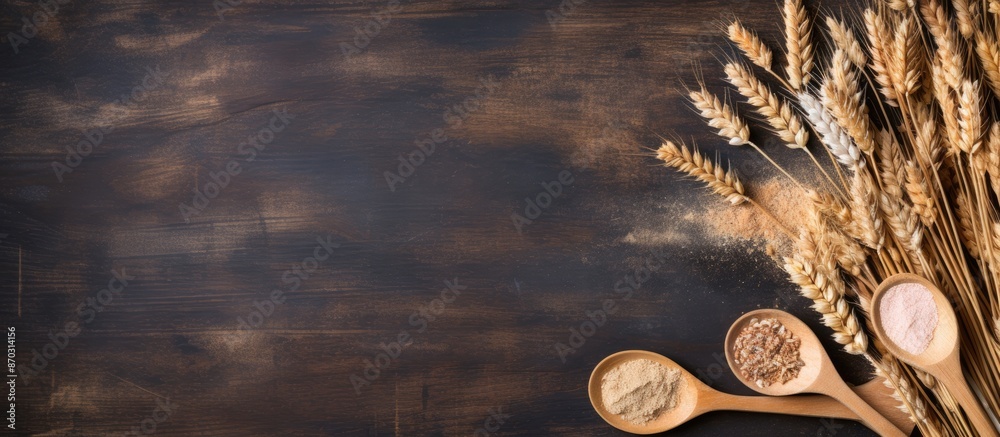 Fototapete wooden spoons and a cutting board placed on a table with scattered flakes and wheat, providing a rus