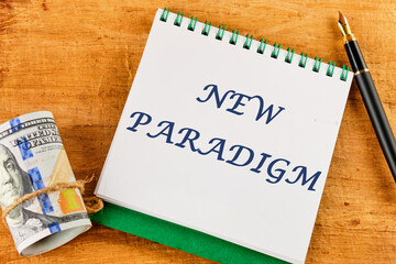NEW PARADIGM word on a blank sheet of notepad against a papyrus background