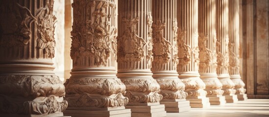 Old columns standing tall with intricate carvings and designs, fill the copy space image.