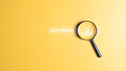 TRENDS in the next year 2025 concept. Magnifying glass with number 2025 and chart trending icon for business strategy marketing trend and business plan in the new year. Brainstorming for new ideas.