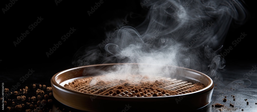 Poster Selective focus on rustic sieve with smoke: Roasted coffee on black backdrop in a visually appealing copy space image.