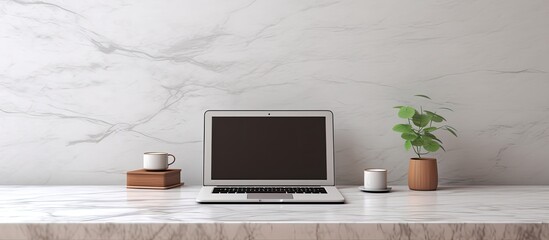 Workspace with laptop on marble table providing copy space image.