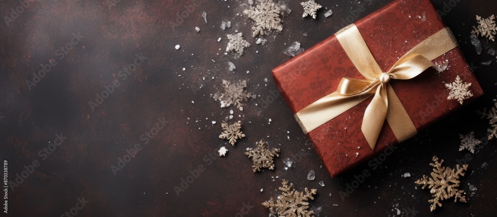 Poster a beautifully adorned gift displayed for a christmas card with ample copy space for an image, seen f