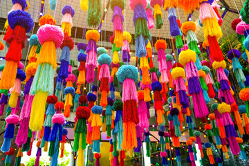 Obraz premium Decorations hanging colored jellyfish made from woolen threads and pompom balls suspended on the ceiling