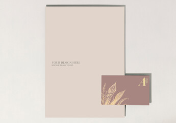 Business Card And Paper Flatlay Mockup