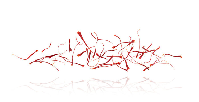 Flying saffron stamens composition isolated on white background. 