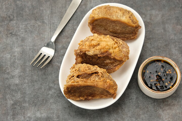 Tahu Walik, fried tofu stuffed with meatball. Indonesian food

