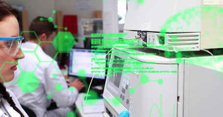 Chemists working in a laboratory on a computer
