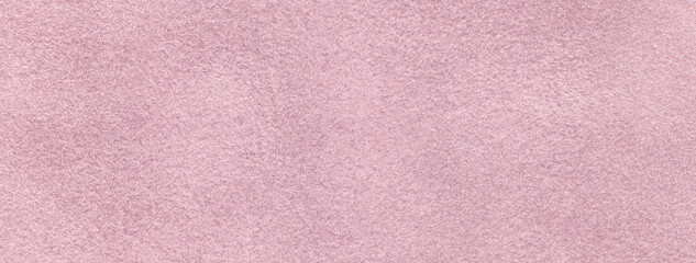 Lilac and pink matte background suede fabric, closeup. Velvet texture light purple textile
