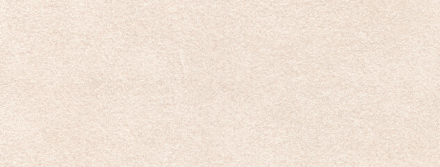 Light beige matte background of suede fabric, closeup. Velvet texture of seamless cream textile