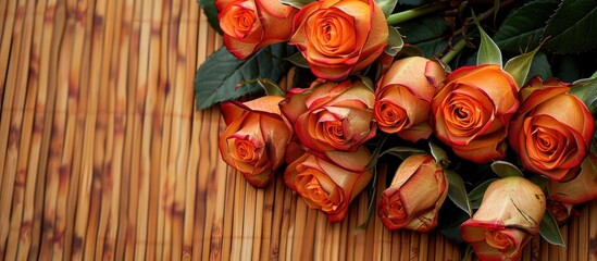 A beautiful bouquet of roses placed on a mat with an empty space for an image. image with copy space