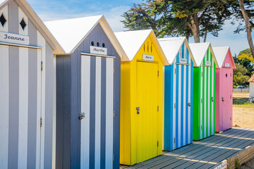 Front of multicolored bath cabins of the beach of La Bree-les-Bains, France
