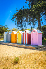 Colored wooden small huts of the beach of La Bree-les-Bains, France
