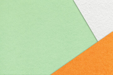 Fototapeta premium Texture of craft light green color paper background with white and orange border. Vintage abstract mint cardboard.
