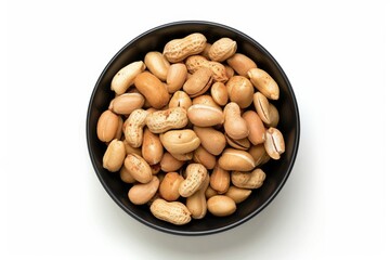 Paprika peanuts in black bowl  whole and broken  top view.