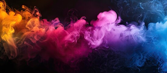 Fototapeta premium Colored smoke billows against a black backdrop ideal for Halloween designs; conveying a vibrant, dynamic, and spooky ambiance with reserved copy space.