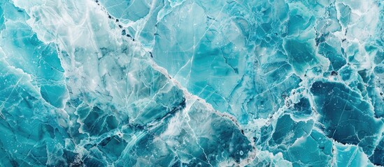 Fototapeta premium Background banner with a textured blue aquamarine turquoise marble granite stone pattern, ideal for showcasing with copy space image.