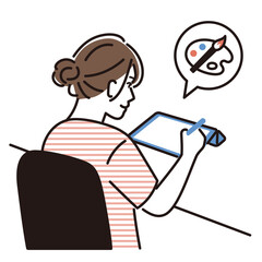 タブレットで絵を描く若い女性の後ろ姿