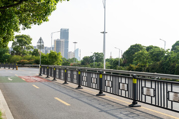 Fototapeta premium Empty urban road and buildings in the city