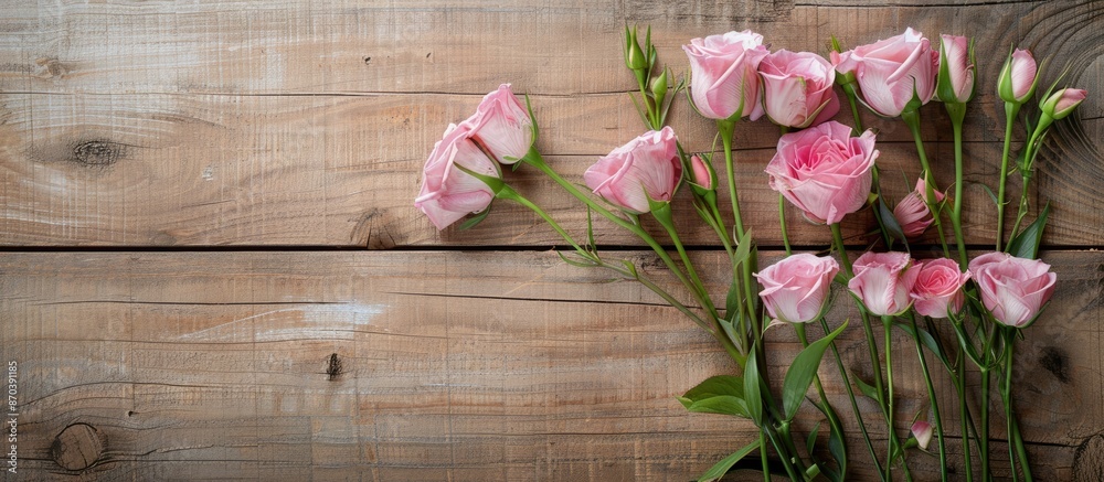 Aufkleber pink eustoma flowers are arranged on a wooden backdrop to create a charming display with copy space 
