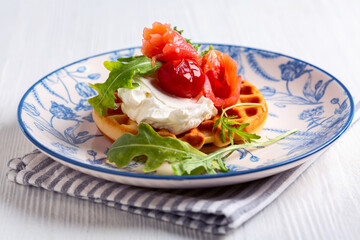 Belgian waffles with salmon and cream cheese.