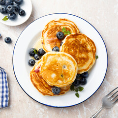 Homemade pancakes with blueberries and honey
