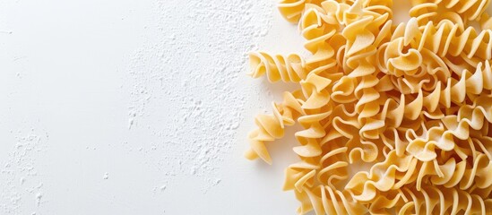 Obraz premium Dry uncooked lasagna noodles on a white background with copy space image.