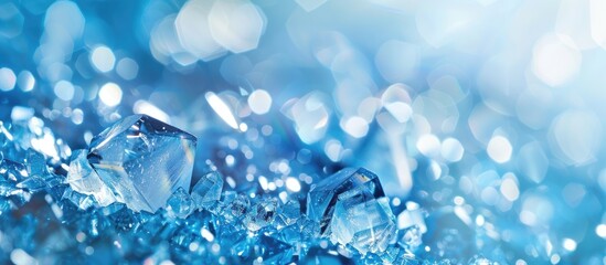 Shiny crystals on an abstract blue background with copy space image.