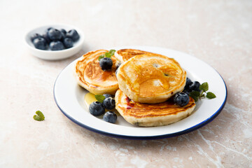Homemade pancakes with blueberries and honey