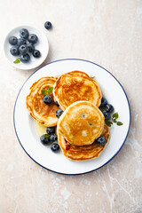 Homemade pancakes with blueberries and honey