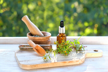 amber Bottle of herbal extract and medicinal plant of Bidens tripartita, Three-lobe Beggarticks on table close up. organic product. useful plant is anti-inflammatory, vitamin, anti allergic agent