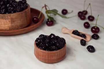 Two bowls of dried cherry. Dried fruit in a bowl. Background of cherries. Cherry fruit. Side view.