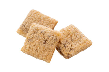 Corn snack. Cereal pads with filling falling into bowl against white background