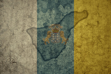 map and flag of tenerife on a old vintage crack paper background .