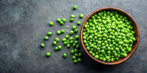 Green peas in a bowl on wooden dark background, top view, healthy food concept, green peas, bowl, wooden