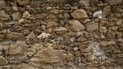Textured wall. Rural construction area. Old form of housing