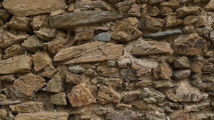 Textured wall. Rural construction area. Old form of housing