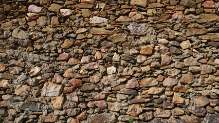 Textured wall. Rural construction area. Old form of housing