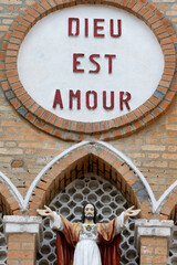 Catholic church. God is love with Jesus statue.  Congo Brazzaville.