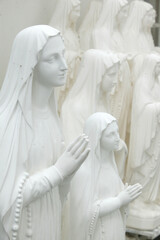 Statuettes of Our Lady of Lourdes made in Lourdes. Religious souvenirs.  France.