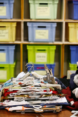 Sorting clothes as part of an integration program with Caritas. France.