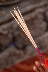  Wat Si Muang ( Simuong) buddhist temple.  Close-up of incense sticks burning. Vientiane. Laos;