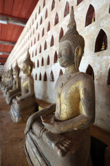 Wat Sisaket (Si Saket) buddhist temple.  Old Buddha statues in the cloister or gallery surrounding...